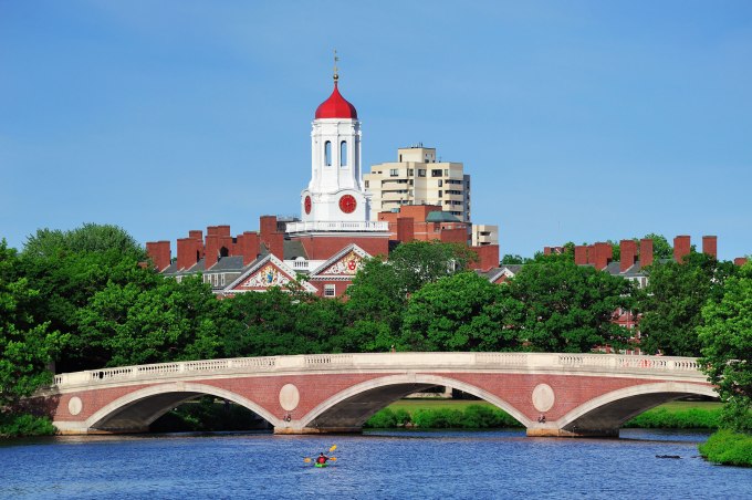 John W. Weeks Bridge and clock tower over Charles River in Harvard University campus.