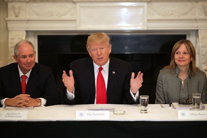 WASHINGTON, DC - FEBRUARY 03: U.S. President Donald Trump (C) delivers opening remarks at the beginning of a policy forum with business leaders with General Motors CEO Mary Barra (R) and chaired by Blackstone Group CEO Stephen Schwarzman in the State Dining Room at the White House February 3, 2017 in Washington, DC. Leaders from the automotive and manufacturing industries, the financial and retail services and other powerful global businesses were invited to the meeting with Trump, his advisors and family. (Photo by Chip Somodevilla/Getty Images)