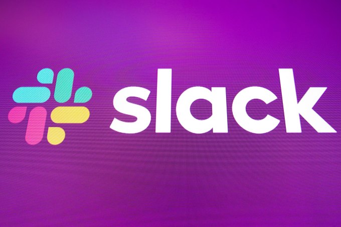 Workplace Messaging App Slack Listed On New York Stock Exchange logo for Slack is displayed on the a monitor at the New York Stock Exchange